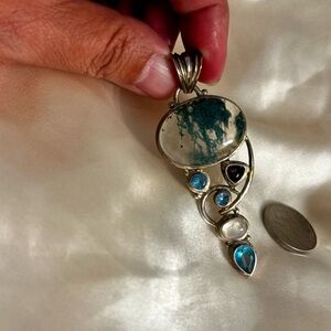 Sterling silver stamped 925 pendant.